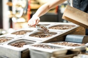 Getting coffee beans from the tray