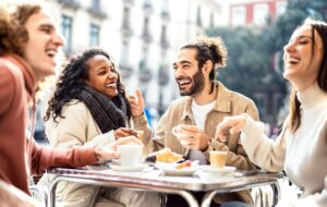 People group drinking cortado at coffee bar patio